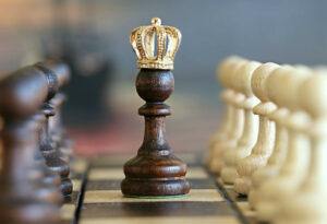 king on chessboard with golden crown